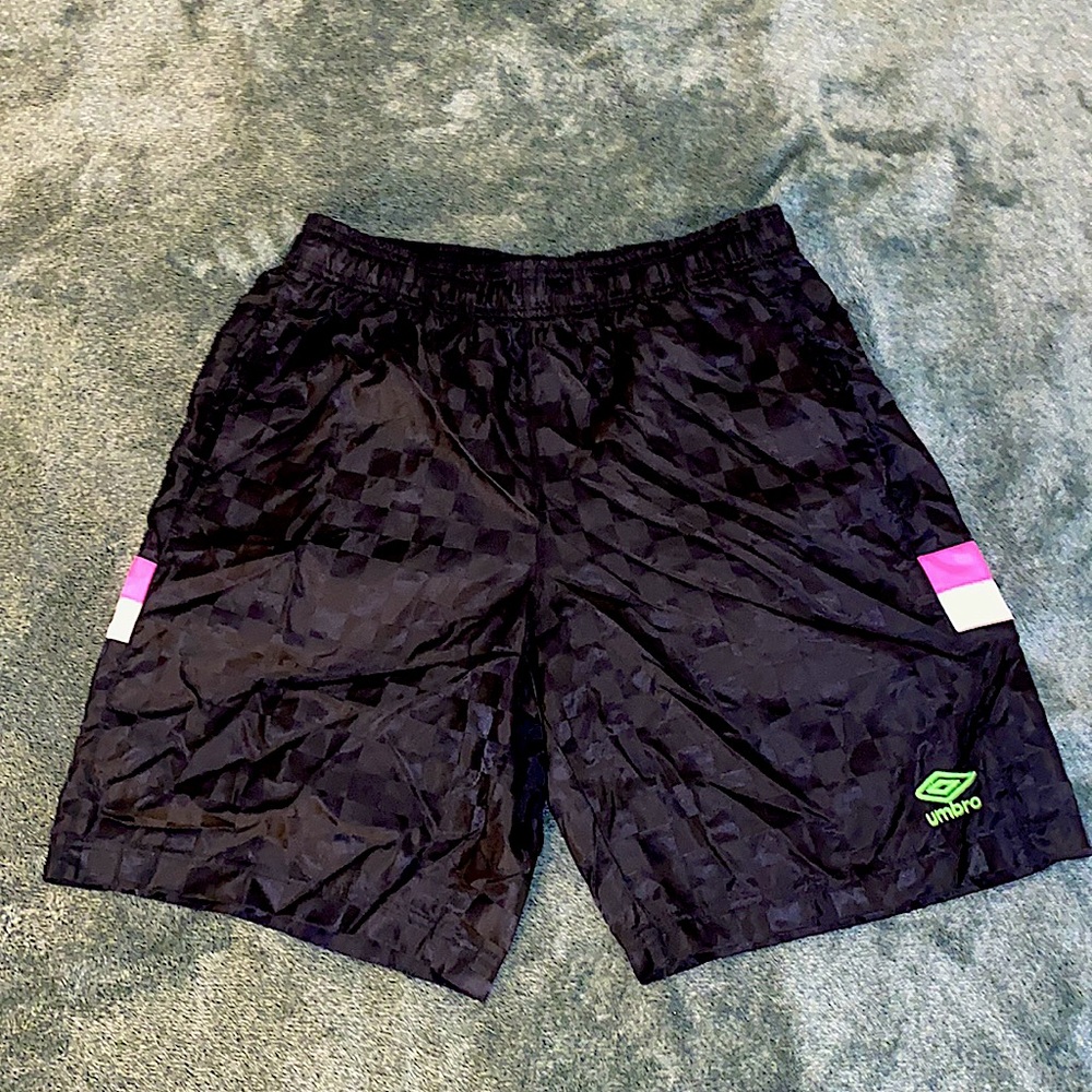 Umbro mens M shiny checkered soccer shorts with neon pink stripe.